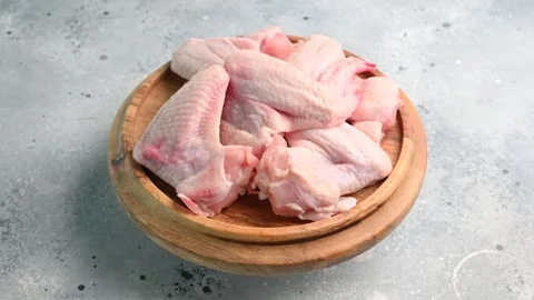 Preparing fresh chicken wings for delicious cooking at home with simple Stock Footage 305228427