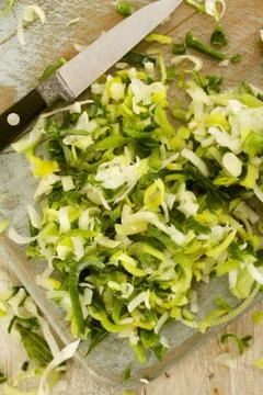 Preparing fresh chopped leeks Stock Photos