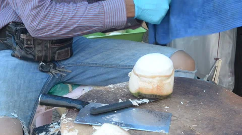 Preparing a fresh coconut. Stock Footage 61446099