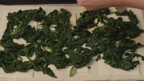 Preparing fresh dish with spinach, melted cheese and ham Stock Footage 125676375