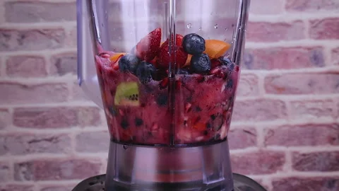 Preparing fresh fruit smoothie in blender Stock Footage 197621985