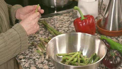 Preparing fresh green asparagus in the kitchen Stock Footage 331218533