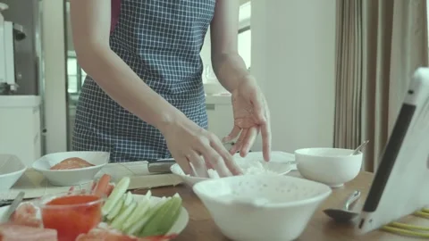 Preparing Fresh Ingredients in a Bright Kitchen Stock Footage 314221706