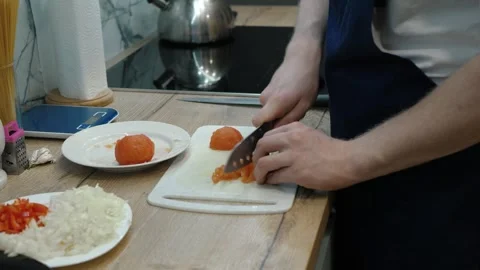 Preparing Fresh Ingredients Delightfully in a Modern Kitchen Stock Footage 312075902