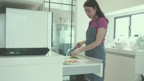 Preparing Fresh Ingredients in a Modern Kitchen Stock Footage 314003478