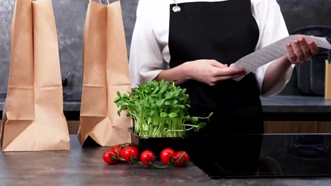 Preparing fresh ingredients in a stylish kitchen for a culinary adventure Stock-Footage 296315549