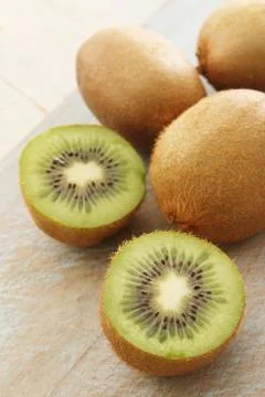 Preparing fresh kiwi fruit Stock Photos