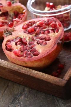 Preparing fresh pomegranate Stock Photos
