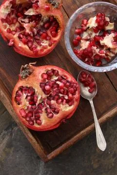 Preparing fresh pomegranate Stock Photos