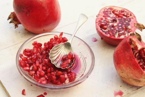 Preparing fresh pomegranate Stock Photos