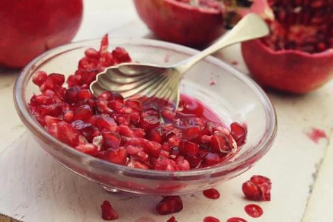 Preparing fresh pomegranate Stock Photos
