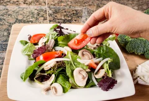 Preparing fresh salad for dinner Stock Photos