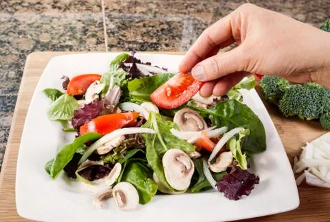 Preparing fresh salad for dinner Stock Photos