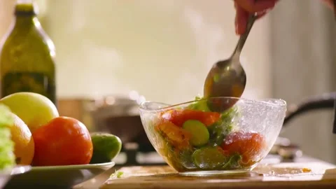 Preparing a Fresh Salad with Lettuce, Cucumber, and Tomato Stock Footage 301832361