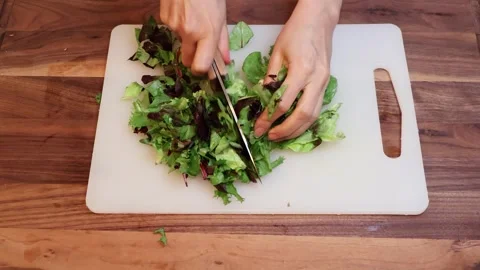 Preparing Fresh Spring Mix Greens for Salad in Kitchen-Horizontal Stock Footage 333789245