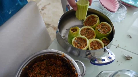 Preparing fresh stuffed zucchini for table, a cook cooks stuffed zucchini, Stock Footage 137065827