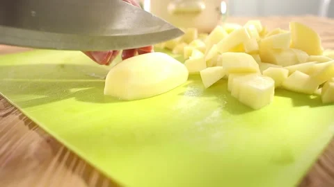 Preparing fresh vegetables. cutting potatoes on a cutting board. healthly food Stock Footage 244444500