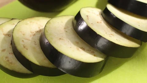 Preparing fresh vegetables. sliced eggplant on a cutting board. healthly food. Video stock 244444127