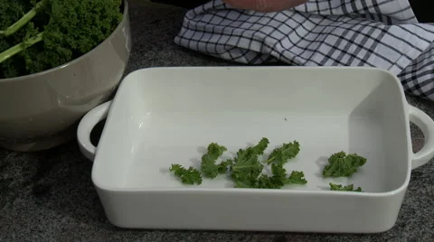 Preparing freshly picked kale in the kitchen Stock Footage 53754919