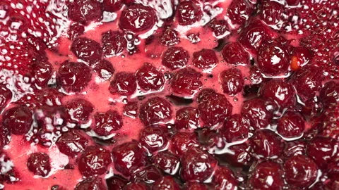 Preparing freshly picked red cherries with sugar to make cherry jam in saucepan Video stock 345708816