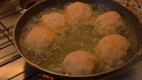 Preparing fried Rice Balls, put in the frying pan - 4K UHD Stock Footage 79661553