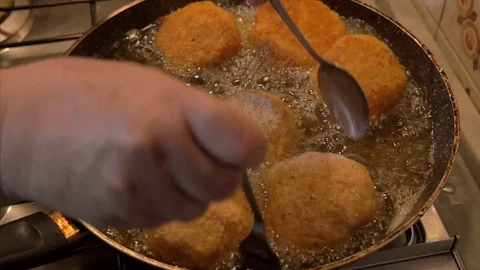 Preparing fried Rice Balls, turn in the frying pan 4K Stock Footage 79662976