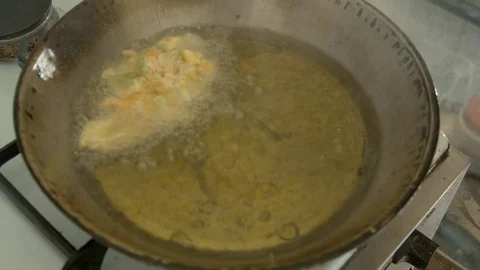 Preparing fried zucchini flowers Stock Footage 75869836