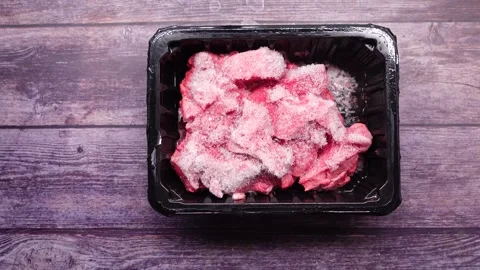 Preparing frozen meat for cooking Stock-Footage 340544577