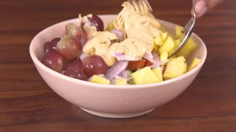 Preparing  Fruit and Vegetable Salad in a bowl Stock Footage 79096905