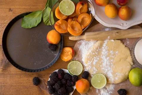 Preparing a fruit pie Stock Photos