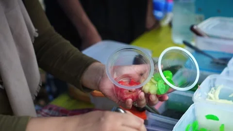 Preparing fruit soup in plastic cups Stock Footage 273227350