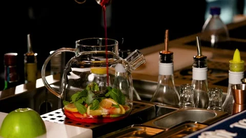 Preparing fruit tea. A bar filled with an array of Food, Tableware, and Liquid Stock Footage 264310175