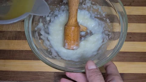 Preparing Garlic sauce with lemon Stockbeeldmateriaal 157396689