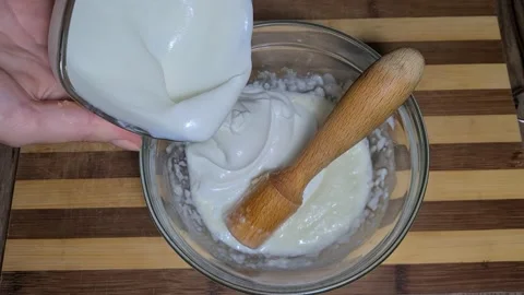 Preparing Garlic sauce with yogurt Stock Footage 157396716