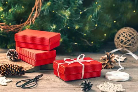 Preparing gift boxes with ribbon for xmas presents Stock Photos