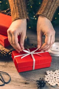 Preparing gift boxes with ribbon for xmas presents Stock Photos