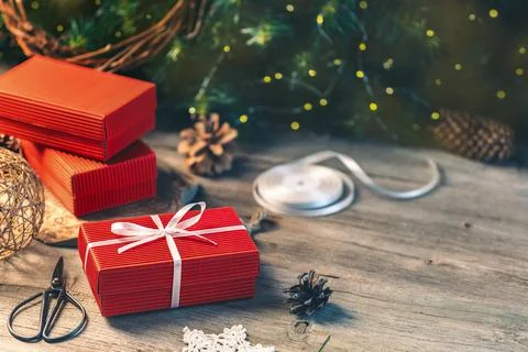 Preparing gift boxes with ribbon for xmas presents Stock Photos