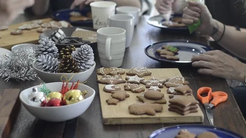 Preparing gingerbread cookies and cupcake for Christmas celebration. Stock-Footage 83081928