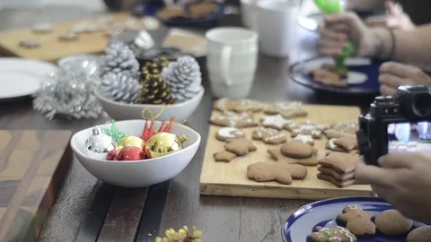 Preparing gingerbread cookies and cupcake for Christmas celebration. 스톡 동영상 83081929