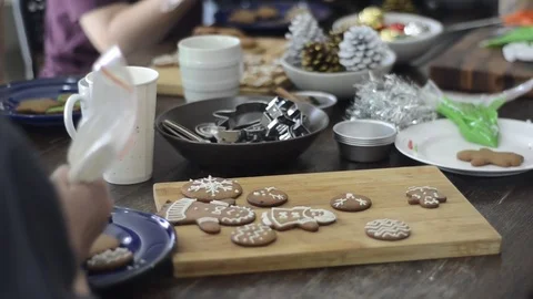 Preparing gingerbread cookies and cupcake for Christmas celebration. 스톡 동영상 83081940