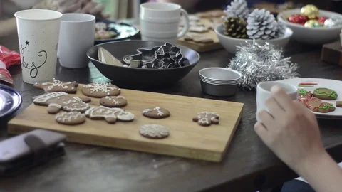 Preparing gingerbread cookies and cupcake for Christmas celebration. 스톡 동영상 83081971
