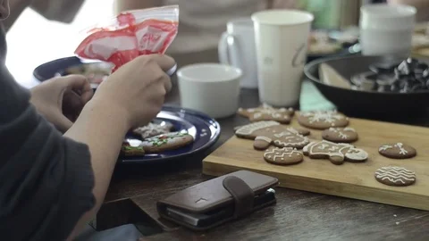 Preparing gingerbread cookies and cupcake for Christmas celebration. Stock Footage 83081976