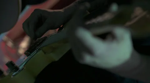 Preparing a Gitar For The Concert Stock Footage 31935727