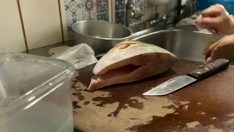 Preparing Golden Pomfret Fish Head Stock Footage 132093443