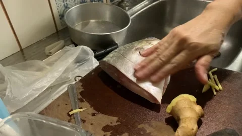 Preparing Golden Pomfret Fish Head Stock Footage 132093464