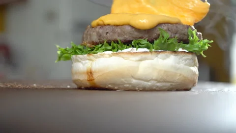 Preparing gourmet burger, adding melted cheese, close up Stock Footage 205307508