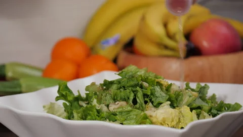 Preparing a gourmet salad with lettuce Stock Footage 154337410