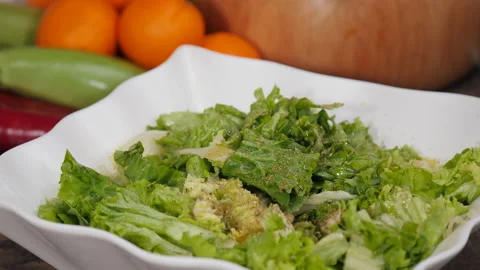 Preparing a gourmet salad with lettuce Stock Footage 154339344