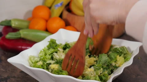 Preparing a gourmet salad with lettuce Stock Footage 154340001