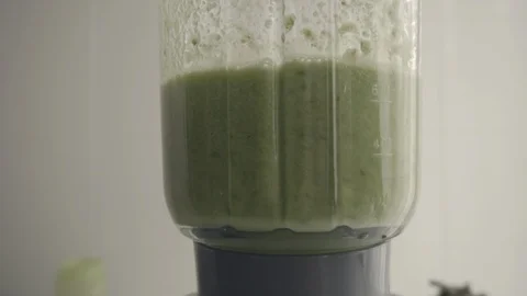 Preparing green juice Stock Footage 86153313